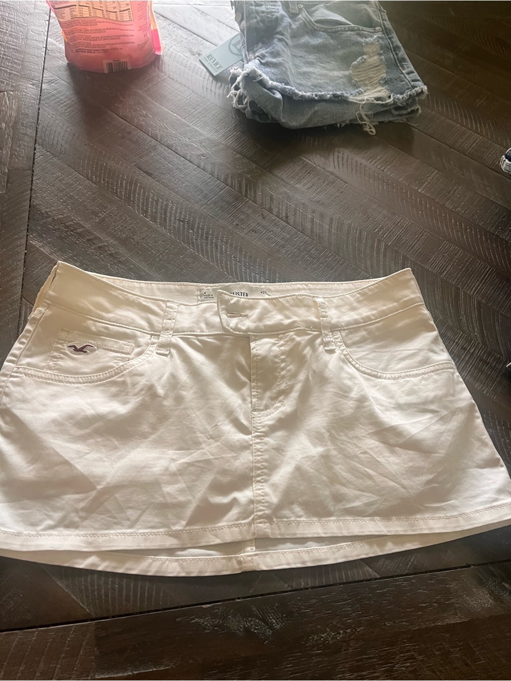 Hollister White Denim Mini Skirt with Branded Button so cute
